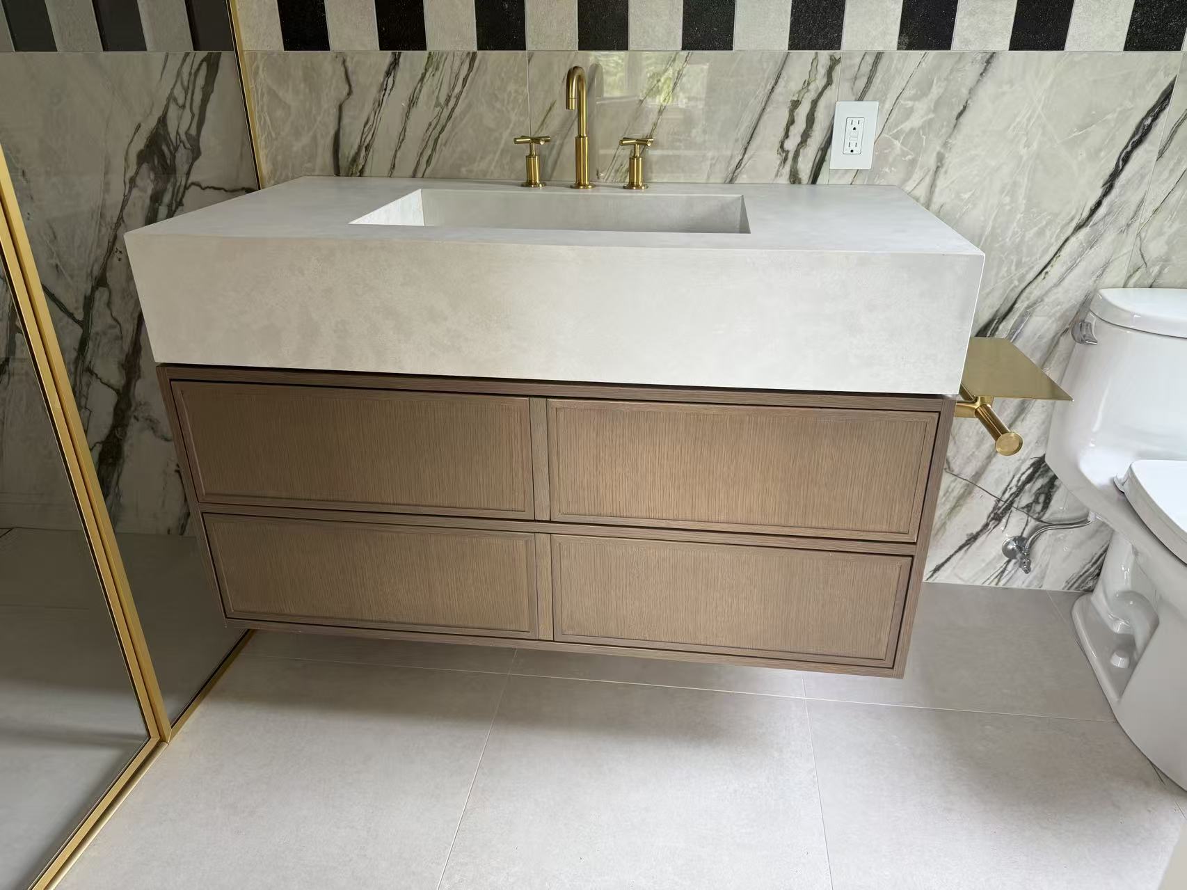 Wood tone vanity marble wall