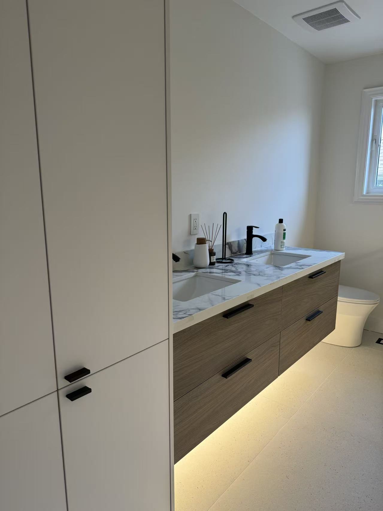 Wood vanity with tower cabinet