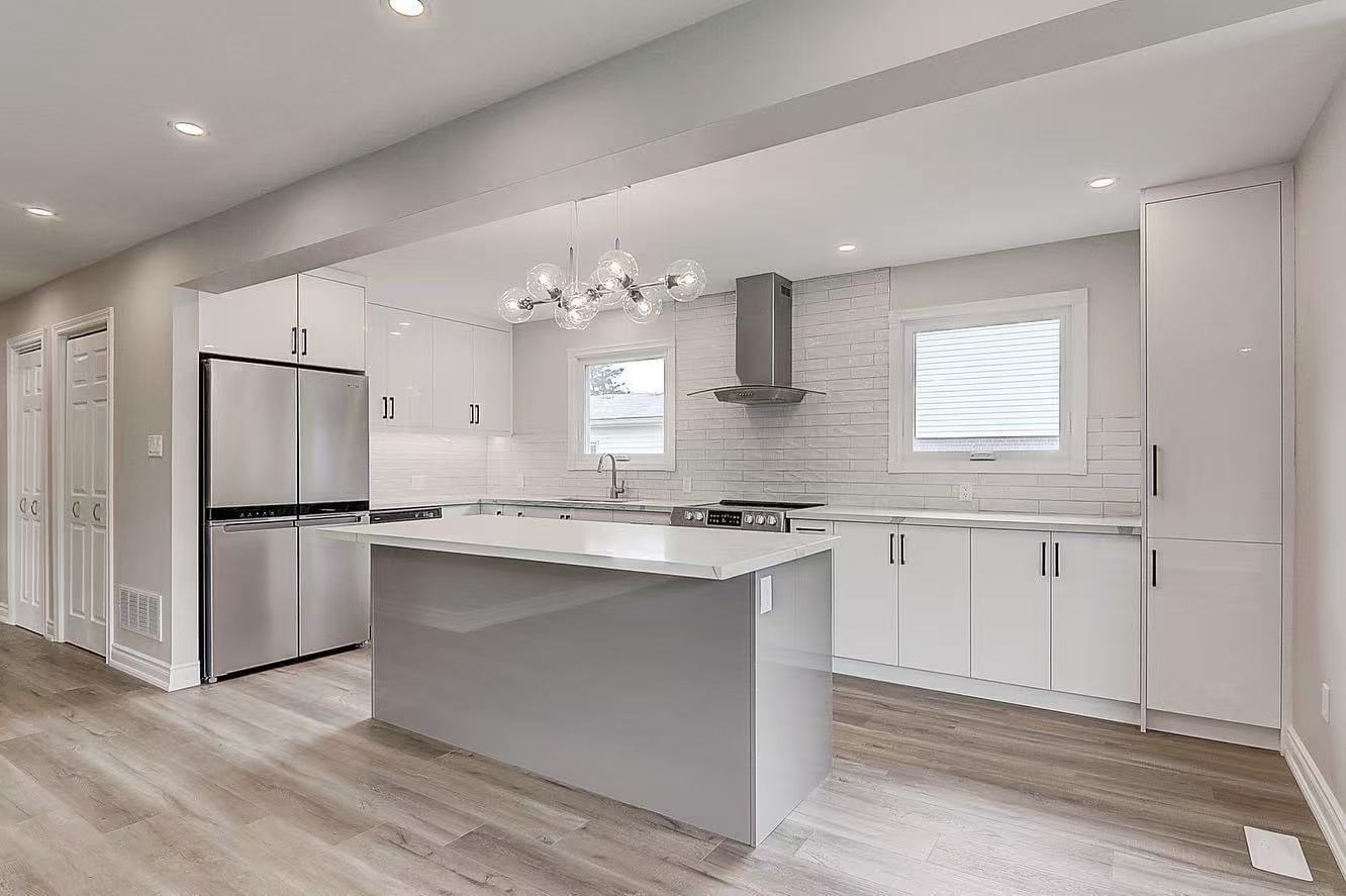 All white kitchen with grey island