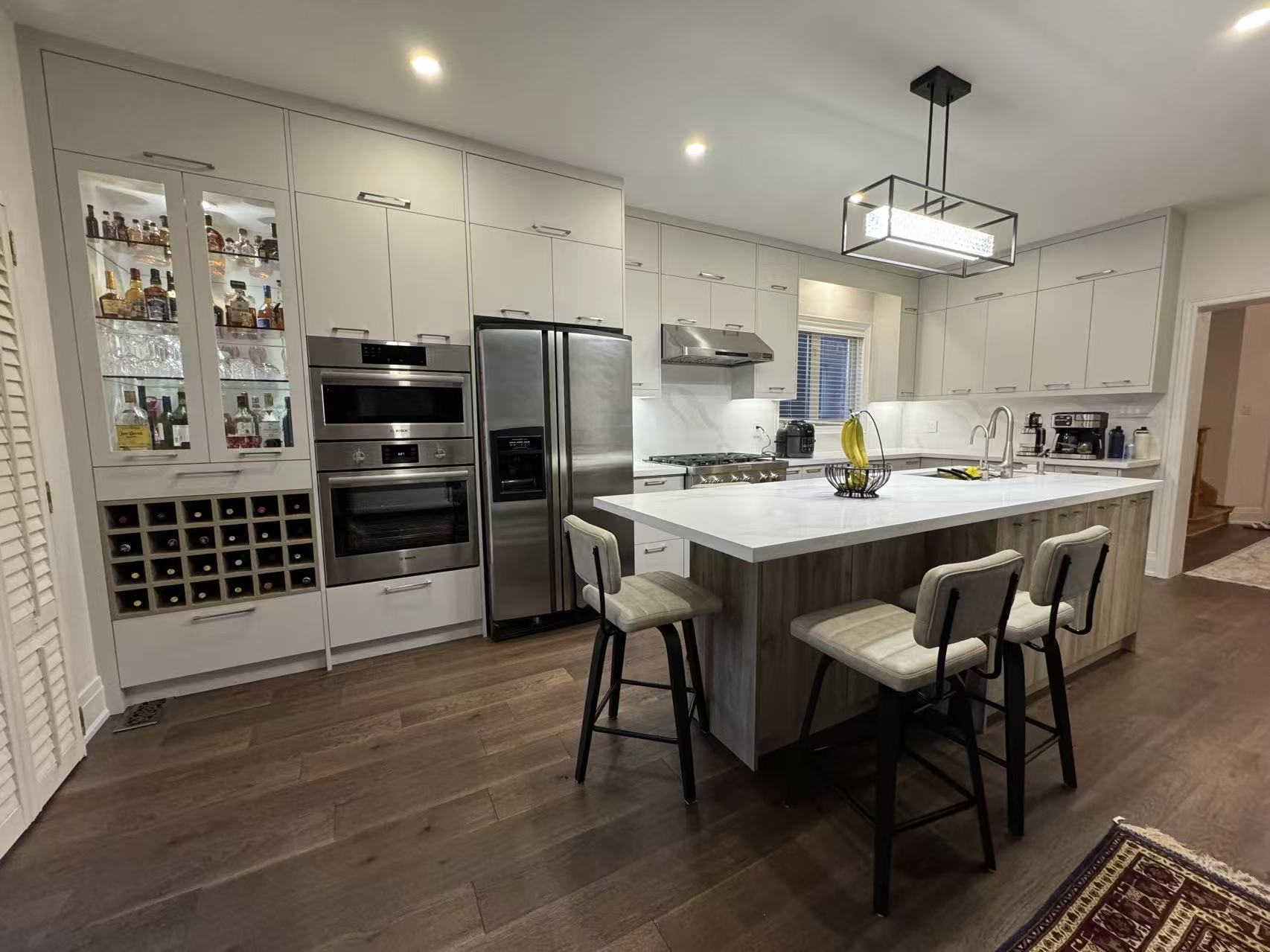 Kitchen with wine rack and ovens
