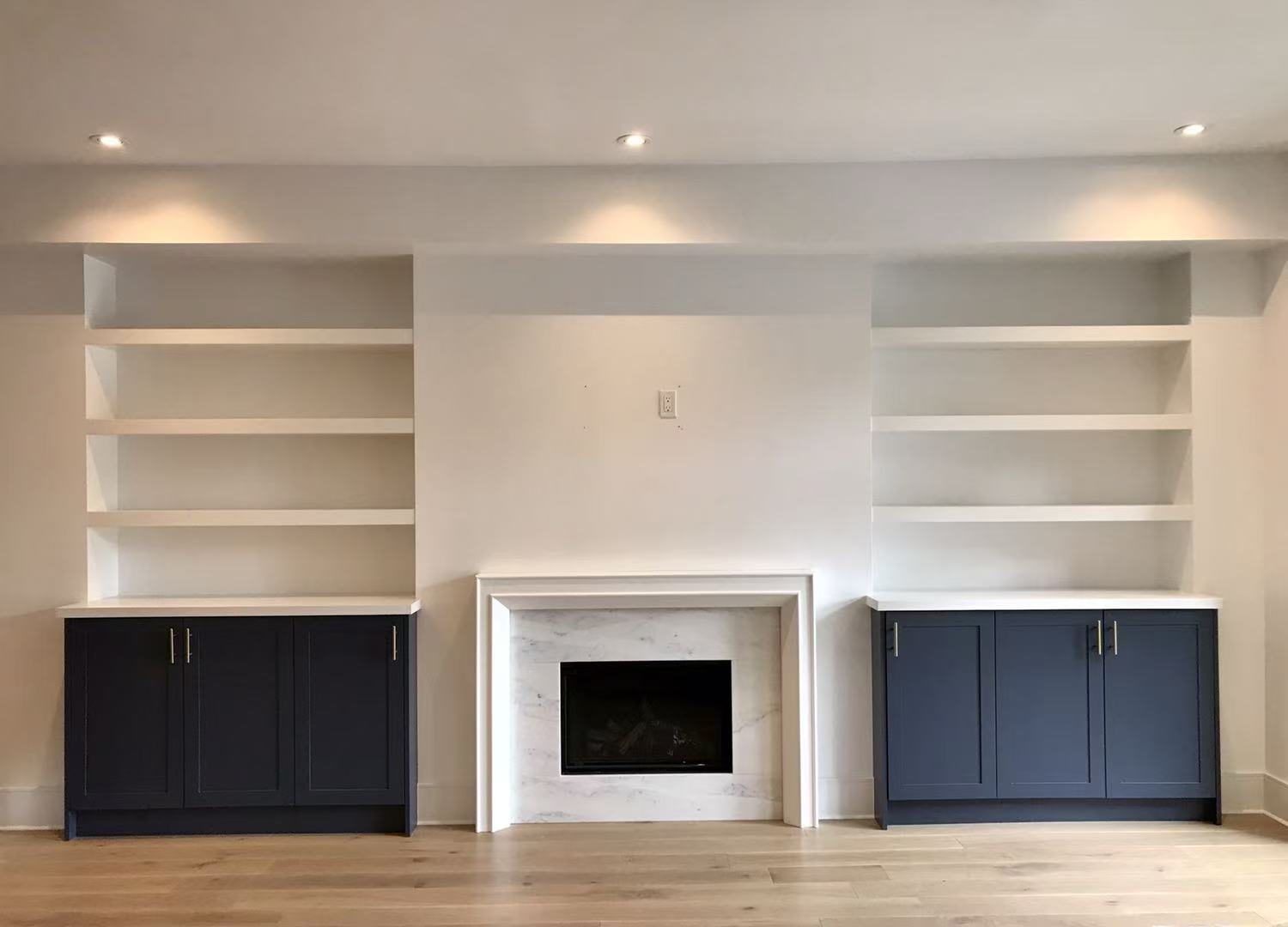 Navy built-ins flanking fireplace