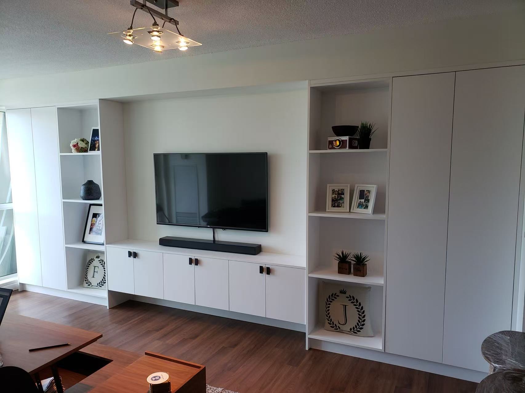 White wall unit with TV