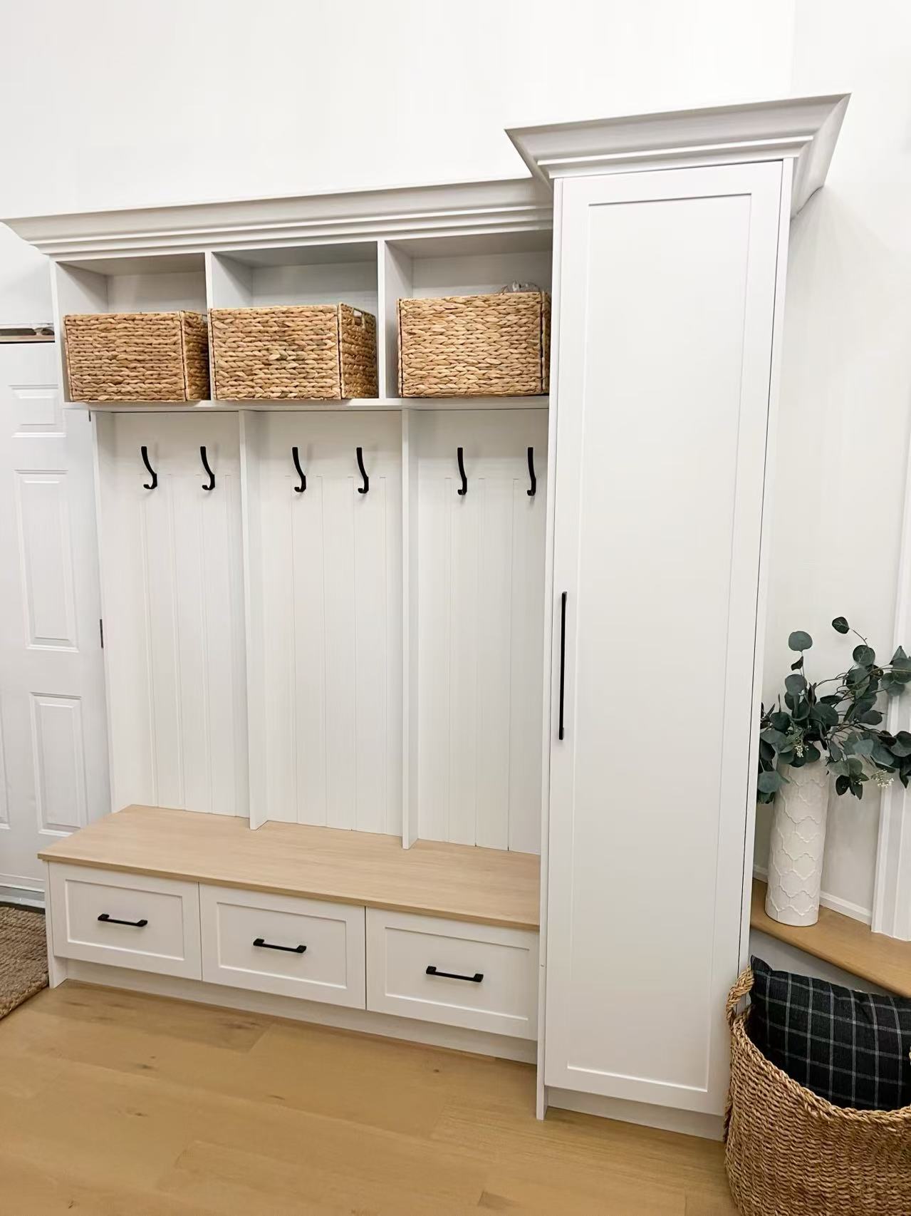 White shaker mudroom with bench